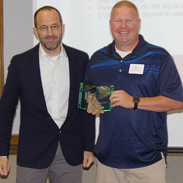 Jason Orsborne and Troy Byler pose together with Jason's plaque.